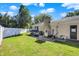 Landscaped backyard with grassy area and pool equipment at 3005 Olive Branch Rd, Greenwood, IN 46143