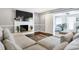 Spacious living room featuring a cozy sectional sofa and a fireplace at 3005 Olive Branch Rd, Greenwood, IN 46143