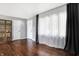 Hardwood floors, gray walls, and a large window with sheer curtains at 3005 Olive Branch Rd, Greenwood, IN 46143