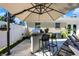 Convenient outdoor kitchen with bar seating and umbrella at 3005 Olive Branch Rd, Greenwood, IN 46143