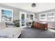 Bright home office with built-in desk and backyard access at 3005 Olive Branch Rd, Greenwood, IN 46143