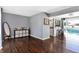 Dark hardwood floors, gray walls, and views of the pool at 3005 Olive Branch Rd, Greenwood, IN 46143
