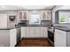 White cabinets, granite countertops, and stainless steel appliances at 3005 Olive Branch Rd, Greenwood, IN 46143