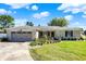 Brick ranch house with attached garage and manicured lawn at 3005 Olive Branch Rd, Greenwood, IN 46143