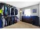Well-organized walk-in closet with ample hanging and shelving space at 3005 Olive Branch Rd, Greenwood, IN 46143