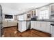 White cabinets, granite countertops, and stainless steel appliances at 3005 Olive Branch Rd, Greenwood, IN 46143