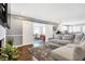 Gray sectional sofa, hardwood floors, and barn doors at 3005 Olive Branch Rd, Greenwood, IN 46143