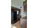 Kitchen with dark wood cabinets and black appliances at 2721 Del Prado Dr, Indianapolis, IN 46227