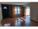 Living room with hardwood floors and dark-colored door at 2721 Del Prado Dr, Indianapolis, IN 46227