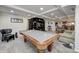 Finished basement with pool table, bar, and seating area at 6502 Allisonville Rd, Indianapolis, IN 46220