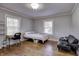 Comfortable bedroom with hardwood floors and home office space at 6502 Allisonville Rd, Indianapolis, IN 46220