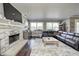 Living room features a stone fireplace and hardwood floors at 6502 Allisonville Rd, Indianapolis, IN 46220