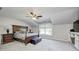 Spacious main bedroom with vaulted ceiling, large window, and ample closet space at 6502 Allisonville Rd, Indianapolis, IN 46220