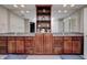 Bathroom with double vanity, granite countertop, and built-in shelving at 6502 Allisonville Rd, Indianapolis, IN 46220