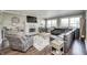 Spacious living room with fireplace, hardwood floors, and leather sectional at 6502 Allisonville Rd, Indianapolis, IN 46220