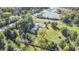 House with a large backyard, trees, and road nearby at 6502 Allisonville Rd, Indianapolis, IN 46220