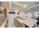 Basement wet bar with granite countertop and shelving at 6502 Allisonville Rd, Indianapolis, IN 46220