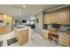 Large kitchen with an island, wood cabinets, and a built-in workspace at 6502 Allisonville Rd, Indianapolis, IN 46220