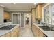 Eat-in kitchen with stainless steel appliances and light wood cabinets at 6502 Allisonville Rd, Indianapolis, IN 46220
