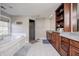 Elegant bathroom with double vanity, soaking tub, and walk-in shower at 6502 Allisonville Rd, Indianapolis, IN 46220