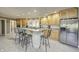Kitchen with light wood cabinets, stainless steel appliances, and island at 6502 Allisonville Rd, Indianapolis, IN 46220