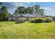 House with spacious backyard, stone patio, and lush landscaping at 6502 Allisonville Rd, Indianapolis, IN 46220