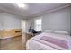 Cozy bedroom with hardwood floors and built-in dresser at 6502 Allisonville Rd, Indianapolis, IN 46220