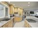Bright kitchen featuring ample counter space, wood cabinets, and stainless steel appliances at 6502 Allisonville Rd, Indianapolis, IN 46220