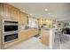 Spacious kitchen with light wood cabinets, stainless steel appliances, and an island at 6502 Allisonville Rd, Indianapolis, IN 46220
