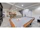Spacious basement recreation room with pool table and seating at 6502 Allisonville Rd, Indianapolis, IN 46220