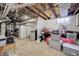 Unfinished basement area with exposed utilities and storage at 6502 Allisonville Rd, Indianapolis, IN 46220