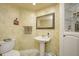 Basement bathroom with pedestal sink and updated fixtures at 6502 Allisonville Rd, Indianapolis, IN 46220
