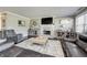 Living room with stone fireplace, hardwood floors, and comfortable seating at 6502 Allisonville Rd, Indianapolis, IN 46220