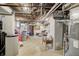 Unfinished basement with exposed pipes and storage area at 6502 Allisonville Rd, Indianapolis, IN 46220