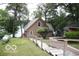 Lake house exterior with wooden stairs leading to the home at 7477 Honey Locust Dr, Nineveh, IN 46164