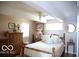 Bedroom with wood dresser and striped bedding at 7477 Honey Locust Dr, Nineveh, IN 46164
