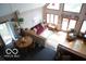 High-ceiling living room with hardwood floors and a view at 7477 Honey Locust Dr, Nineveh, IN 46164