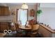 Cozy dining area with round table and four chairs near sliding door at 7477 Honey Locust Dr, Nineveh, IN 46164