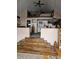 Open loft area with a bedroom visible above the stairs at 7477 Honey Locust Dr, Nineveh, IN 46164