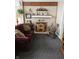 Relaxing living room with a fireplace and rocking chair at 7477 Honey Locust Dr, Nineveh, IN 46164