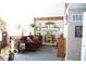 Living room boasts a fireplace and comfy maroon couch at 7477 Honey Locust Dr, Nineveh, IN 46164