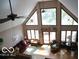 High-ceiling living room with hardwood floors and large windows at 7477 Honey Locust Dr, Nineveh, IN 46164