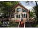 A-frame lake house with large windows and a deck at 7477 Honey Locust Dr, Nineveh, IN 46164