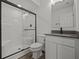 Basement bathroom with shower, toilet and dark vanity at 4231 Barrel Ln, Westfield, IN 46062