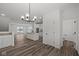 Bright dining room with chandelier and access to a balcony at 4231 Barrel Ln, Westfield, IN 46062