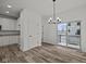 Dining room with chandelier and sliding glass door to balcony at 4231 Barrel Ln, Westfield, IN 46062