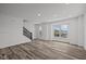 Bright living room featuring hardwood floors and a large window at 4231 Barrel Ln, Westfield, IN 46062