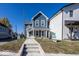 Two-story blue home with a front porch and landscaped yard at 1666 Union St, Indianapolis, IN 46225