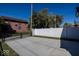Private backyard with concrete patio and white vinyl fence at 1666 Union St, Indianapolis, IN 46225