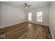 Spacious bedroom with hardwood floors and two windows at 1666 Union St, Indianapolis, IN 46225
